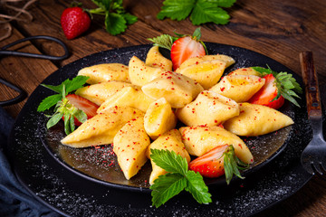 Kopytka - polish potato dumpling with strawberries