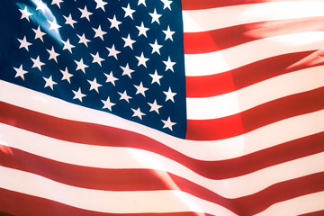 Beautiful vintage US flag waving in the wind. closeup of flag with stars and stripes.