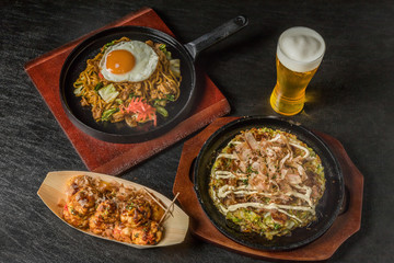 お好み焼き Okonomiyaki is a Japanese-style pancake