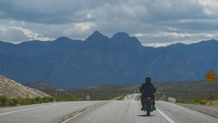 Motorcycle Through the Mountain Valley