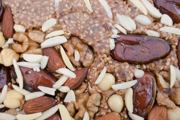 A mixture of nuts. Various nuts in the store, juicy snacks sold in the market. Food for vegetarians. Eastern sweetness.