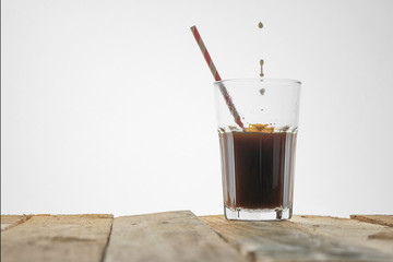 Iced coffee on a white background, with copy space. Cool summer drink