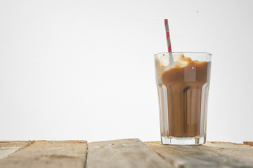 Iced coffee on a white background, with copy space. Cool summer drink