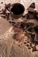chocolate, cocoa powder and coffee cup