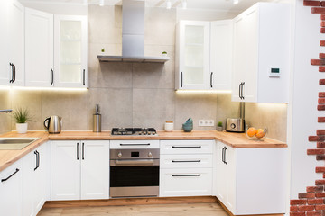 Stylish white scandinavian kitchen interior with decor accessories