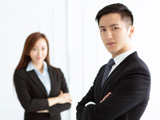 Young smiling business woman and business man