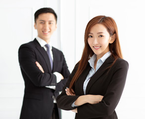 Young smiling business woman and business man