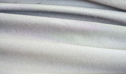 Fine details, patterns and textures, silver gray synthetic fabri
