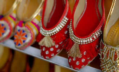   Closeup Indian woman fashion shoes or  footwear in display outdoors in front of a retail shop     