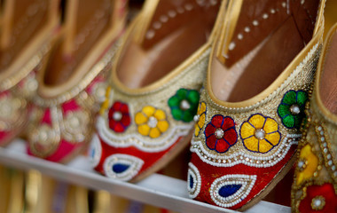   Closeup Indian woman fashion shoes or  footwear in display outdoors in front of a retail shop                     
