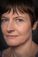 Fototapeta premium Paris, France - 05 19 2019: Studio photo session with my girlfriend. Woman with expressive face and blue eyes