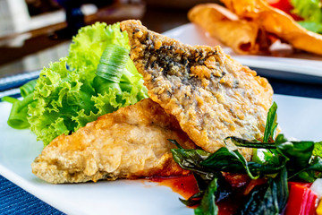 deep fried seabass in hot and spicy sauce - Thai halal food