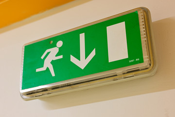 Emergency luminaire with green information table.