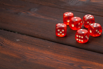 Dice on wooden table. Background for casino games.