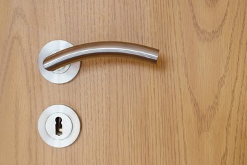 Door handle - detail of  modern wooden interior door