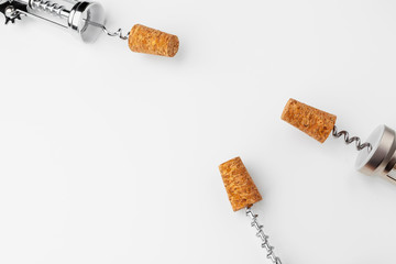 corkscrew and wine cork isolated on white background