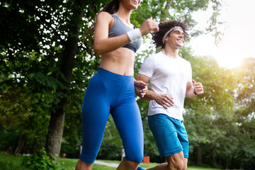 Couple jogging and running outdoors in nature