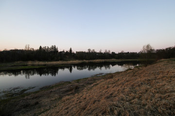 Beautiful countryside river view with amazing sunset in the background. 