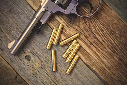 Vintage revolver Nagant and the seven golden cartridges