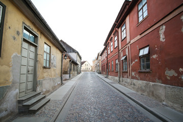 Beautiful old village coutnryside street with bricks and old houses.