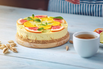 Raw citrus cake with grapefruit, orange, lime and lemon. Healthy fresh summer dessert. Gluten free, no baking vegan food