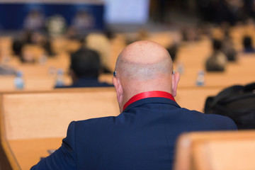 Businessman at business conference room with public giving presentations. Audience at the conference hall. Entrepreneurship club.