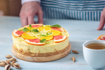 Raw citrus cake with grapefruit, orange, lime and lemon. Healthy fresh summer dessert. Gluten free, no baking vegan food