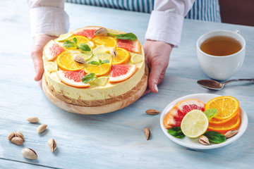 Raw citrus cake with grapefruit, orange, lime and lemon. Healthy fresh summer dessert. Homemade vegan food