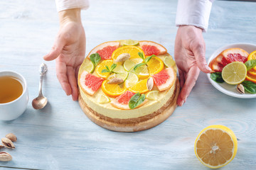 Obraz na płótnie Canvas Raw citrus cake with grapefruit, orange, lime and lemon. Cooking at home healthy summer vegan dessert