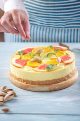 Raw citrus cake with grapefruit, orange, lime and lemon. Cooking at home healthy summer vegan dessert