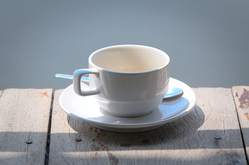 cup of coffee on wooden table