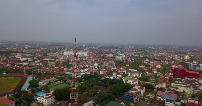 flying around main city antenna and next to national stadium above the city in Vientiane, laos