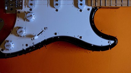 electric guitar behind the glass with water drops . color background