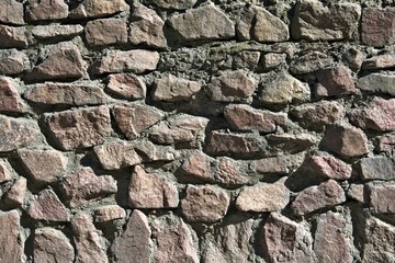 closeup of the surface of the old stone masonry