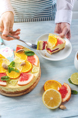 Raw citrus cake with grapefruit, orange, lime and lemon with nuts and mint. Cooking healthy fresh summer vegan dessert