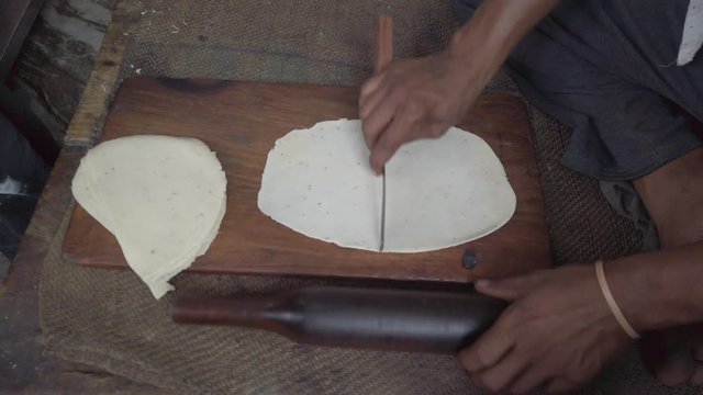 Close-up preparation of dough for cooking Samosa, mixture of maida flour stuffed with potato, popular traditional north Indian vegetarian street snack food slow motion Handheld stabilized gimbal 4k 