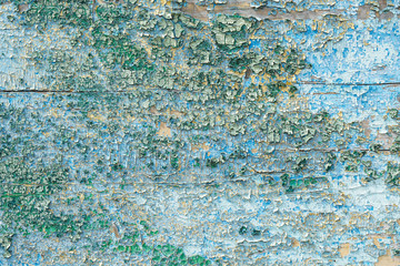 Crackled paint on wooden surface Abstract background