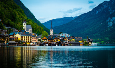 Fototapeta na wymiar Amazing scenery of austrian town Hallstatt at the lake and high mountains