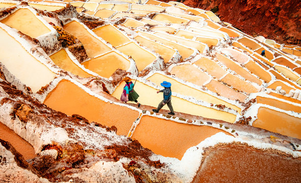 Workers at Salinas de Maras near Cusco, salt extraction in Peru