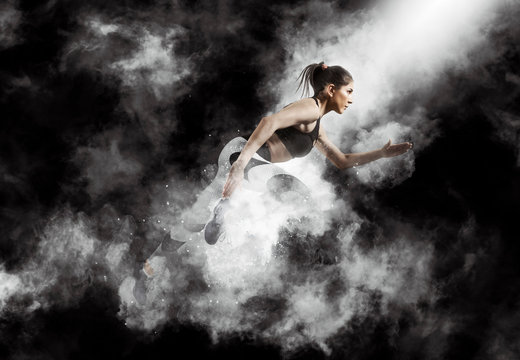 Sporty young woman running © Andrey Burmakin