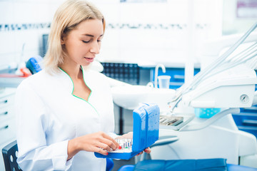 dental doctor in white uniform in stomathology office