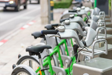 Fototapeta na wymiar green bicycle for rent in city / bike for rent