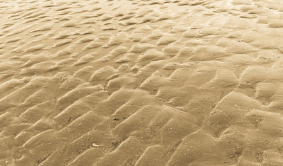 Sandy beach background with natural patterns and lines