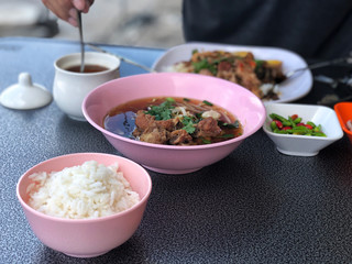 Break fast with Pork Clear Soup in pink bowl and rice in pink cup, delicious of  Thai food , Name of this menu in Thailand : 