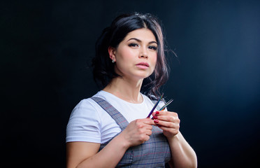 Obraz premium Cosmetic tweezer. Extensions make everyday eye makeup unnecessary. Girl makeup face hold tweezer for eyelash extension. Beauty shop concept. Professional eyelash extension tweezer. Makeup artist