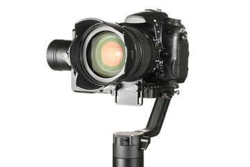 Gimbal three-axis motorized stabilizer with mounted DSLR camera isolated on white background