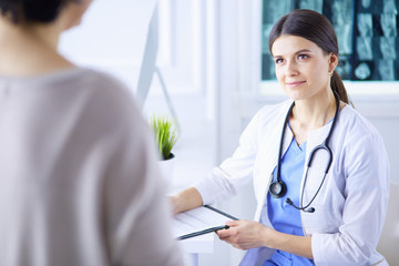 Medical consultation in a hospital. Doctor listening to a patient's problems