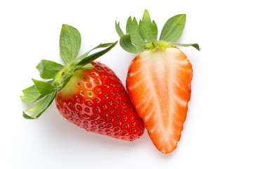 Ripe half strawberry isolated on white background.