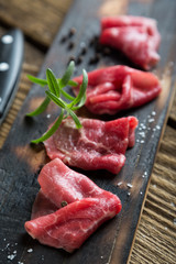 Thinly sliced beef pieces. beef carpaccio