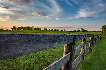 Fototapeta na wymiar Wooden rail fence in Kentucky bluegrass region